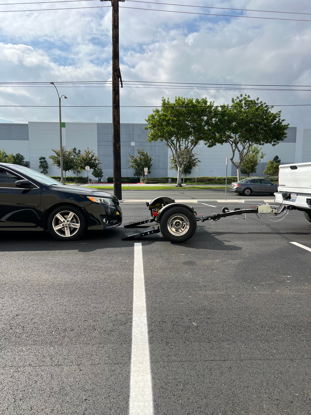 "Conveniently foldable car tow dolly for easy storage"