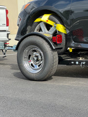 "Car tow dolly's Demco surge brakes close-up"