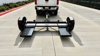 Premier car tow dolly rear view with ramps down, showing 79.5 inch swivel pan loading path behind pickup truck