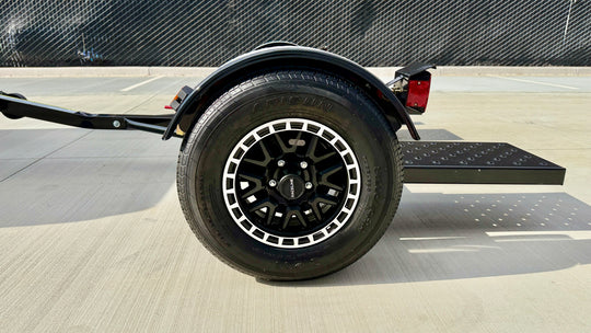 Raceline alloy wheel with Arisun ST205/75R14 trailer tire on the Premier car tow dolly