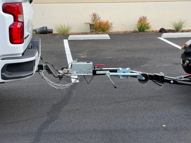 "Innovative car tow dolly design that rivals traditional tow bars"