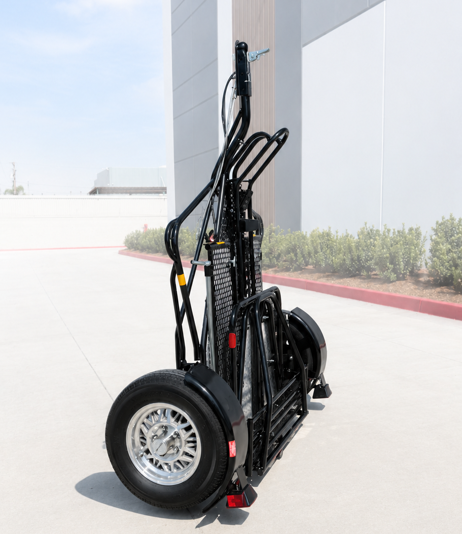 Alpha Sport single-rail motorcycle trailer with silver alloy wheels on a white background